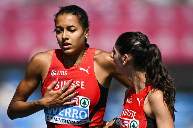 Switzerland's Audrey Werro (L) reacts after competing and falling in the women's 800m semi-final 1 during the European Athletics Championships at Alexander Stadium in Birmingham on August 13, 2026. (Photo by Paul ELLIS / AFP)
