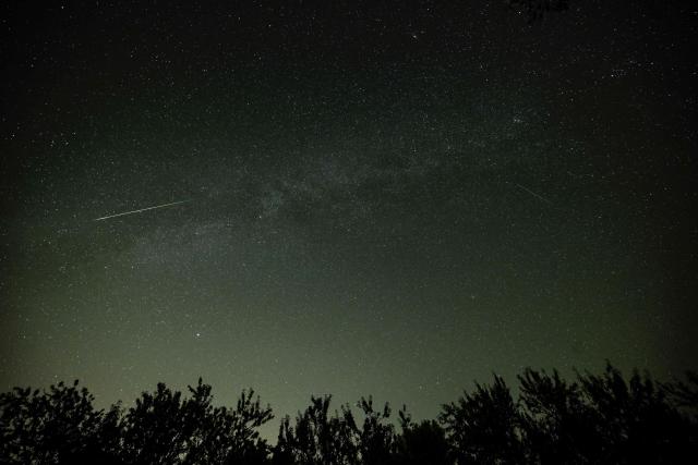 A meteor streaks across the night sky during the Perseid meteor shower as seen from San Asensio, La Rioja region, on August 12, 2026. The Perseid meteor shower, which occurs annually when planet Earth passes through the debris cloud left by Comet Swift-Tuttle, reached its spectacular peak overnight on August 12–13. (Photo by ANDER GILLENEA / AFP)