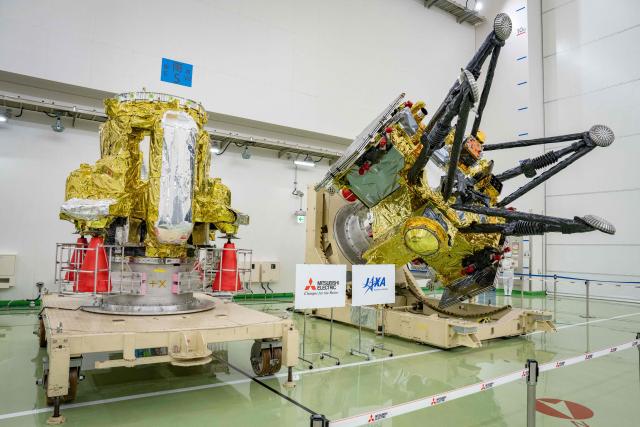 Propulsion Module (L) and Exploration and Return Modules (R), making up the Martian Moons eXploration (MMX) spacecraft, are seen at the Tanegashima Space Center in Minamitane, Kagoshima prefecture on August 13, 2026. (Photo by Yuichi YAMAZAKI / AFP)