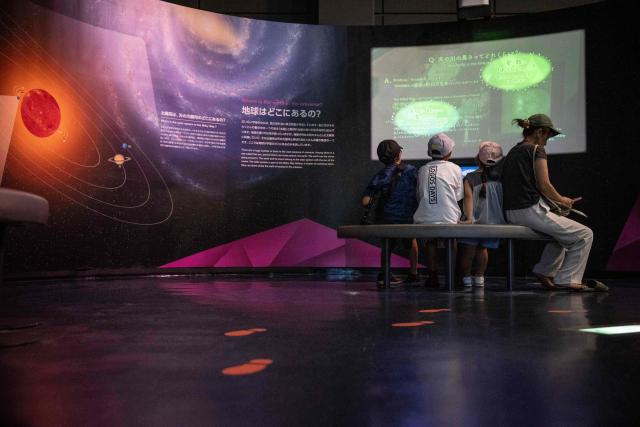 People visit the Space Science and Technology Museum at the Tanegashima Space Center in Minamitane, Kagoshima prefecture on August 13, 2026. (Photo by Yuichi YAMAZAKI / AFP)