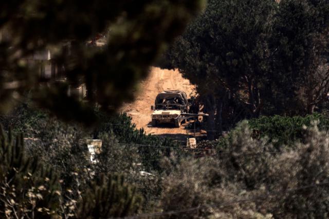 This picture taken from the southern Lebanese village of Zawtar al-Gharbiyah shows Israeli humvees driving through the nearby village of Zawtar al-Charkiyah on August 13, 2026. Lebanese Prime Minister Nawaf Salam on August 12 condemned Israel's "systematic destruction" in the country's south as a violation of international law, as Israel's defence minister said its military was "destroying all the houses" there. (Photo by Ammar Ammar / AFP) / 