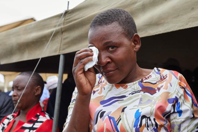 Chengetai Marumisa, a survivor, reacts during a memorial service held for victims of the capsized Rural Infrastructure Development Agency (RIDA) passenger ferry at Nyamhunga Stadium in Kariba, on August 13, 2026. A government passenger ferry capsized on Zimbabwe's Lake Kariba, claiming at least 44 lives, authorities said. A witness told AFP that after the ferry sank in rough weather on August 11 bodies could be seen in the water as rescuers tried to reach the vessel, which was entirely overturned. (Photo by Jekesai NJIKIZANA / AFP)