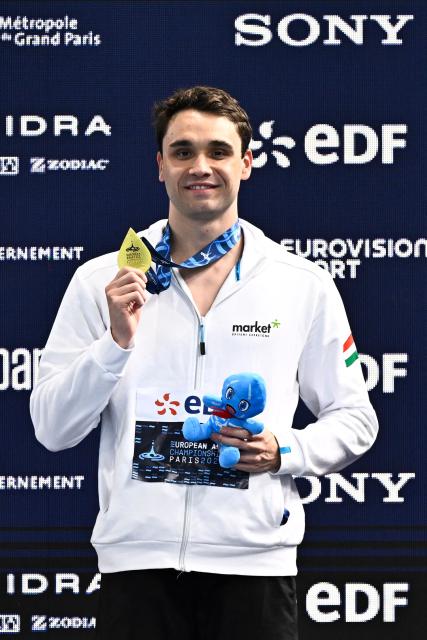 Gold medallist  Hungary's Kristof Milak poses on the podium of the men's 100m butterfly swimming event during the LEN European Aquatics Championships at the Olympic Aquatic Centre in Saint-Denis, northern suburbs of Paris, on August 13, 2026. (Photo by JULIEN DE ROSA / AFP)