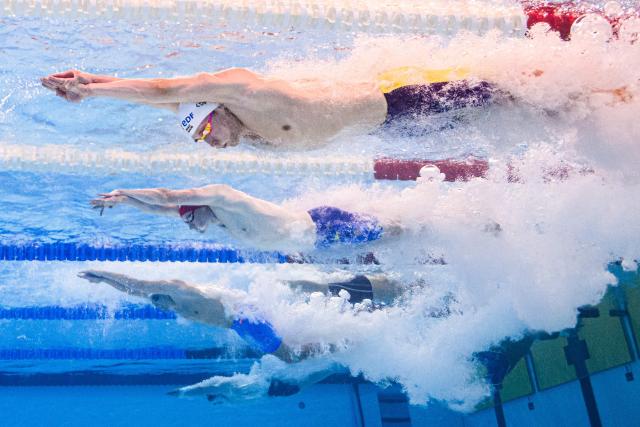 Neutral Athlete B's swimmer Aleksandr Shchegolev (top), Britain's swimmer Gabriel Shepherd (C) and Spain's swimmer Miguel Perez Godoy Brageli (down) compete during  the final of the men's 4x100m freestyle relay swimming event during the LEN European Aquatics Championships at the Olympic Aquatic Centre in Saint-Denis, northern suburbs of Paris, on August 13, 2026. (Photo by Sébastien BOZON / AFP)