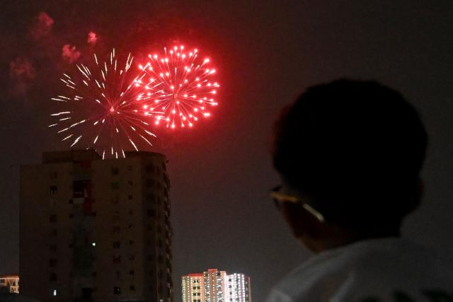 A boy watches a firework explode during celebrations ahead of Pakistan's 79th anniversary of Independence Day in Karachi on August 14, 2026. (Photo by Rizwan TABASSUM / AFP)