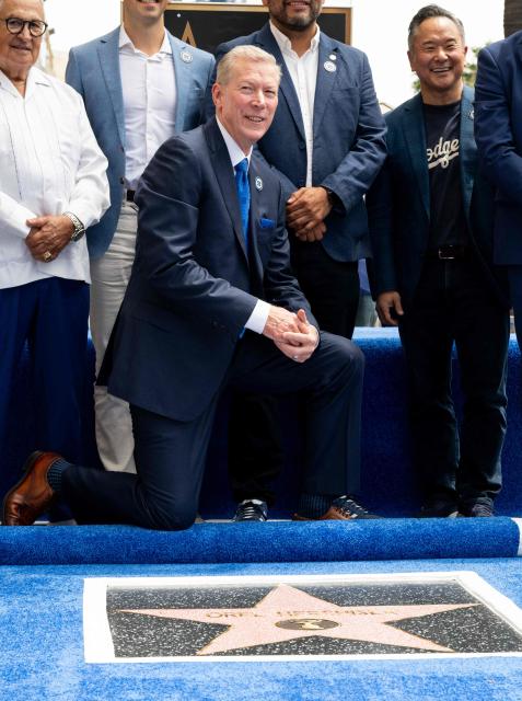 US former professional baseball pitcher and sports broadcast analyst Orel Hershiser poses on his newly unveiled star during his Walk of Fame star ceremony in the Hollywood neighborhood of Los Angeles on August 13, 2026. (Photo by Katie FLORES / AFP)
