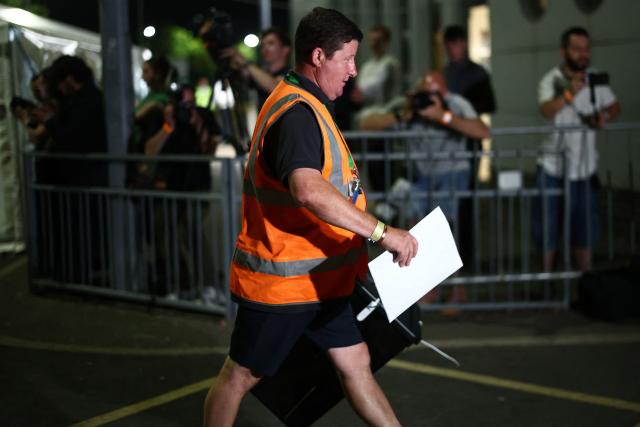 A ballot box is carried into the count centre venue for the by-election of the parliamentary seat of Clacton, at Clacton Leisure Centre, eastern England on August 13, 2026. Voters in eastern England headed to the polls on August 13 for a by-election triggered by hard-right Reform UK leader Nigel Farage. (Photo by Henry Nicholls / AFP)
