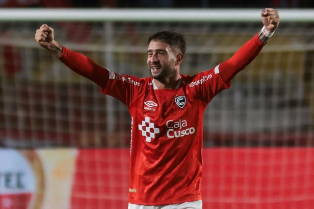 Cienciano's Argentine midfielder #16 Marcos Martinich celebrates scoring his team's fourth goal during the first leg of the Copa Sudamericana round of 16 football match between Peru's Cienciano and Brazil's Botafogo, at the Inca Garcilaso de la Vega stadium in Cusco, Peru, on August 13, 2026. (Photo by Jose Angulo / AFP)