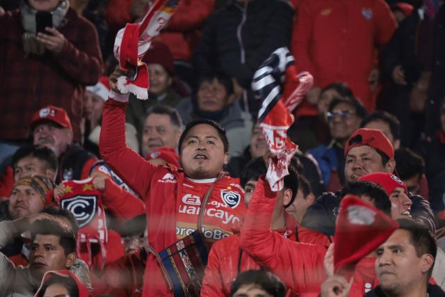 Fans of Cienciano celebrate at the end of the first leg of the Copa Sudamericana round of 16 football match between Peru's Cienciano and Brazil's Botafogo, at the Inca Garcilaso de la Vega stadium in Cusco, Peru, on August 13, 2026. (Photo by Jose Angulo / AFP)
