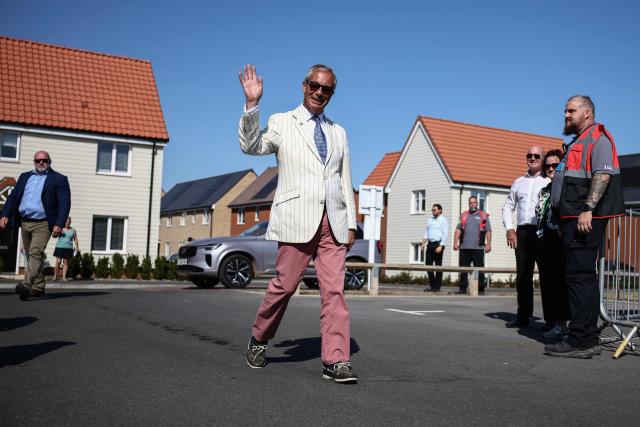 (FILES) Reform UK leader Nigel Farage (C) arrives to vote in the Clacton by-election, at a makeshift polling station in a primary school in Walton-on-the-Naze, Essex on August 13, 2026. British hard-right leader Nigel Farage has won a snap UK election he triggered in Clacton on August 14, comfortably beating satirical opponent Count Binface as was expected, according to results. (Photo by Henry NICHOLLS / AFP)