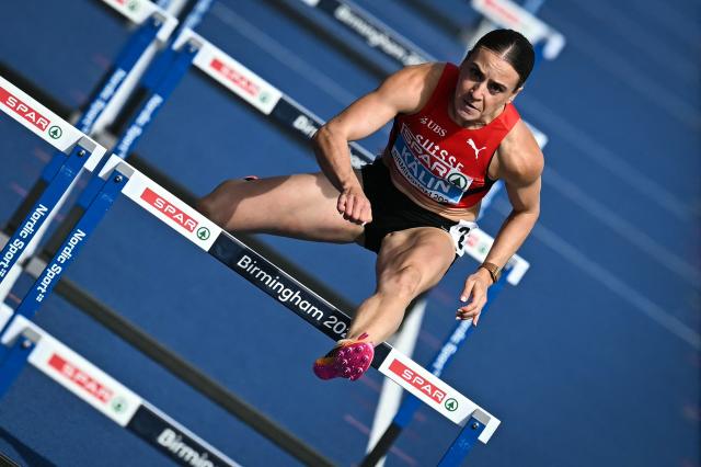Switzerland's Annik Kalin competes in the women's heptathlon 100m hurdles heat 3 during the European Athletics Championships at Alexander Stadium in Birmingham on August 14, 2026. (Photo by Paul ELLIS / AFP)