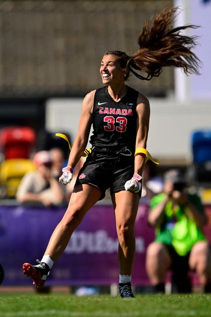 Canada's Catherine Gaumont celebrates during the women's match between Japan and Canada at the "IFAF World Flag" World Championship in flag football in Duesseldorf, western Germany, on August 14, 2026. (Photo by Ina FASSBENDER / AFP)