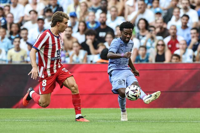Marseille's English midfielder #07 Angel Gomes fights for the ball with Atletico Madrid's Spanish midfielder #08 Pablo Barrios during the pre-season friendly football match between Olympique de Marseille (OM) and Club Atletico de Madrid at Stade Velodrome in Marseille, southern France on August 14, 2026. (Photo by Thibaud MORITZ / AFP)