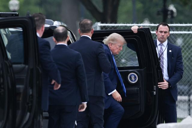 US President Donald Trump steps out of his limousine to board Marine One on the Ellipse near the White House in Washington, DC, on August 14, 2026. Trump is on his way to Garden City, New York to speak at the Nassau County Police Academy Center for Training and Intelligence before continuing to Bedminster, New Jersey, to spend the weekend at his golf club. (Photo by Brendan SMIALOWSKI / AFP)