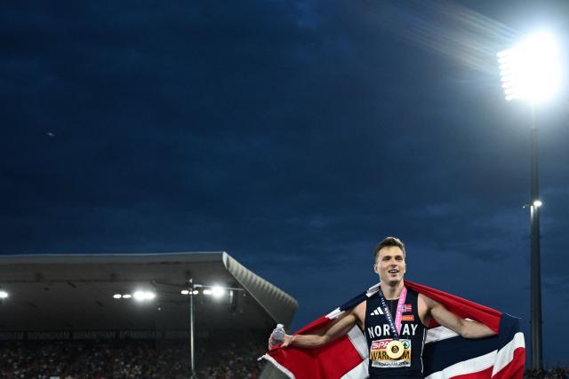 Gold medallist Norway's Karsten Warholm celebrates after winning the men's 400m hurdles final and breaking the championship record during the European Athletics Championships at Alexander Stadium in Birmingham on August 14, 2026. (Photo by Paul ELLIS / AFP)