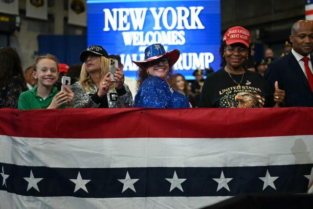 Attendees listen to US President Donald Trump deliver remarks at the Nassau County Police Academy Center for Training and Intelligence in Garden City, New York, on August 14, 2026. (Photo by Kent NISHIMURA / AFP)