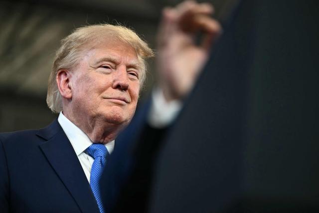US President Donald Trump looks on at the Nassau County Police Academy Center for Training and Intelligence in Garden City, New York, on August 14, 2026. (Photo by Kent NISHIMURA / AFP)
