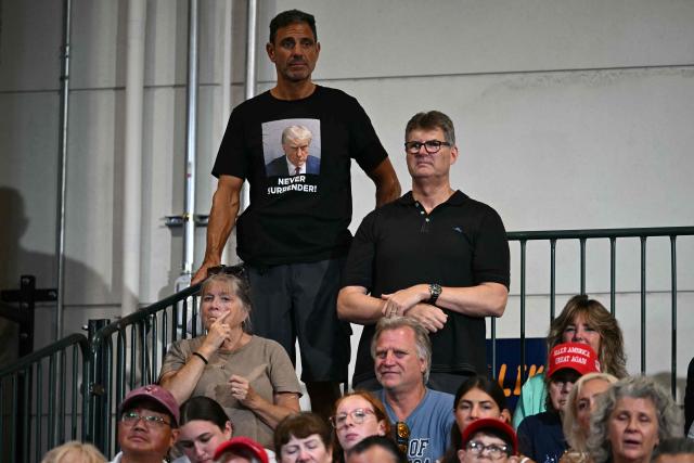 Attendees listen to US President Donald Trump deliver remarks at the Nassau County Police Academy Center for Training and Intelligence in Garden City, New York, on August 14, 2026. (Photo by Kent NISHIMURA / AFP)