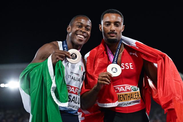 Joint bronze medallists Italy's Eseosa Fostine Desalu (L) and Switzerland's Timothe Mumenthaler (R) celebrate after competing in the men's 200m final during the European Athletics Championships at Alexander Stadium in Birmingham on August 14, 2026. (Photo by Paul ELLIS / AFP)
