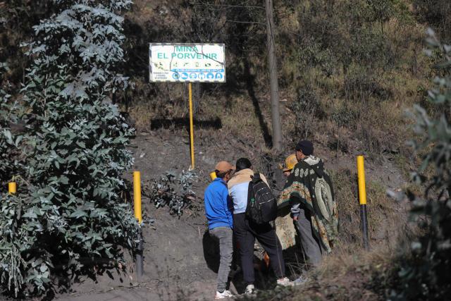 Relatives and fellow miners gather outside the El Porvenir 1 mine following an explosion that killed six miners in La Ramada, Cundinamarca department, Colombia, on August 14, 2026. Six workers at a mine in central Colombia were found dead by rescuers on August 14 after being trapped by an explosion, departmental authorities said. (Photo by ESTEBAN VEGA LA-ROTTA / AFP)
