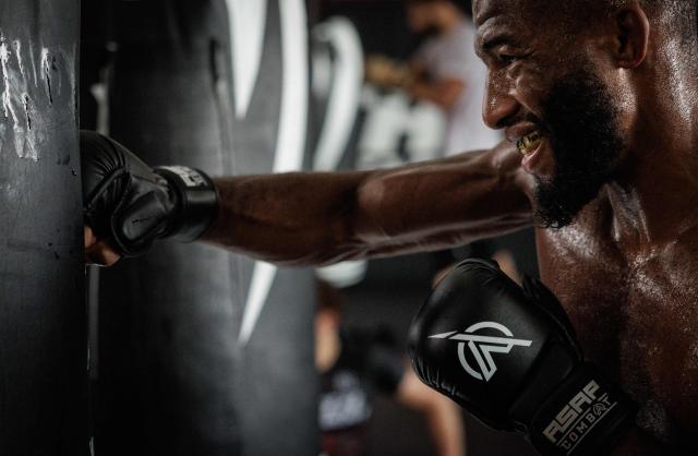 French-Moroccan mixed martial artist Salahdine Parnasse hits a punching bag during a training session at the Atch Academy training centre in Aubervilliers, a northern Paris suburb on August 13, 2026. For his UFC debut, Salahdine Parnasse is making a grand entrance as the headliner at UFC Paris – a "new beginning" in his career, according to the 28-year-old Frenchman, who is aiming to become the "ultimate fighter". (Photo by SIMON WOHLFAHRT / AFP)