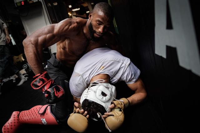 French-Moroccan mixed martial artist Salahdine Parnasse fights with a training partner during a training session at the Atch Academy training centre in Aubervilliers, a northern Paris suburb on August 13, 2026. For his UFC debut, Salahdine Parnasse is making a grand entrance as the headliner at UFC Paris – a "new beginning" in his career, according to the 28-year-old Frenchman, who is aiming to become the "ultimate fighter". (Photo by SIMON WOHLFAHRT / AFP)