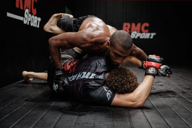 French-Moroccan mixed martial artist Salahdine Parnasse fights with a training partner during a training at the Atch Academy training centre in Aubervilliers, a northern Paris suburb on August 13, 2026. For his UFC debut, Salahdine Parnasse is making a grand entrance as the headliner at UFC Paris – a "new beginning" in his career, according to the 28-year-old Frenchman, who is aiming to become the "ultimate fighter". (Photo by SIMON WOHLFAHRT / AFP)