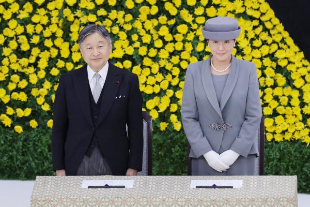 Japan's Emperor Naruhito (L) and Empress Masako (R) attend the National War Memorial Ceremony at the Nippon Budokan in Tokyo on August 15, 2026, on the 81st anniversary of Japan's surrender in World War II. (Photo by JIJI Press / AFP) / Japan OUT