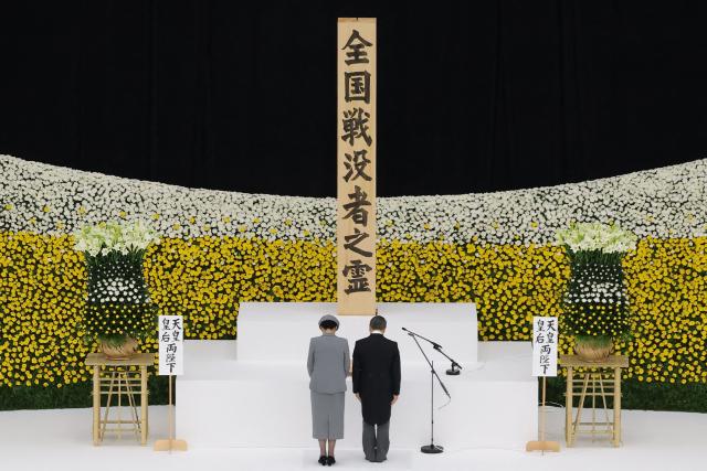 Japan's Emperor Naruhito (R) and Empress Masako (L) attend the National War Memorial Ceremony at the Nippon Budokan in Tokyo on August 15, 2026, on the 81st anniversary of Japan's surrender in World War II. (Photo by JIJI Press / AFP) / Japan OUT