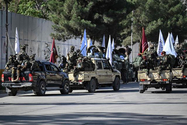 A convoy of Taliban security personnel is parked near the former US Embassy in Kabul on August 15, 2026 as they celebrate the fifth anniversary of the Taliban government's return to power. The Taliban government celebrates five years of ruling Afghanistan on August 15, with the authorities hailing their country's "freedom" and security, while critics decry tightening restrictions in all areas of daily life. (Photo by Wakil Kohsar / AFP)