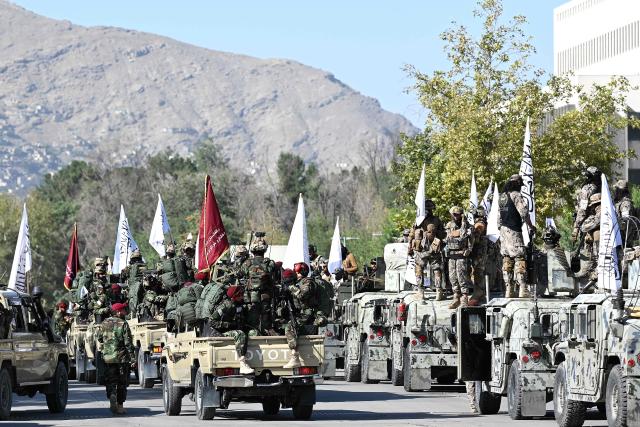 A convoy of Taliban security personnel is parked near the former US Embassy in Kabul on August 15, 2026 as they celebrate the fifth anniversary of the Taliban government's return to power. The Taliban government celebrates five years of ruling Afghanistan on August 15, with the authorities hailing their country's "freedom" and security, while critics decry tightening restrictions in all areas of daily life. (Photo by Wakil Kohsar / AFP)