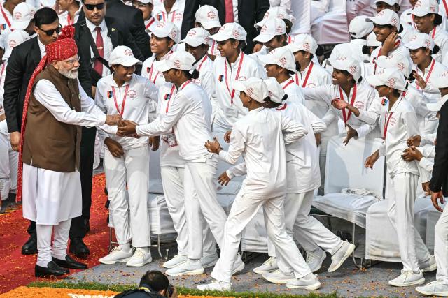 India's Prime Minister Narendra Modi (L) meets with the members of National Cadet Corps (NCC) after addressing the nation at the Red Fort during the celebrations to mark country's Independence Day in New Delhi on August 15, 2026. (Photo by Sajjad HUSSAIN / AFP)