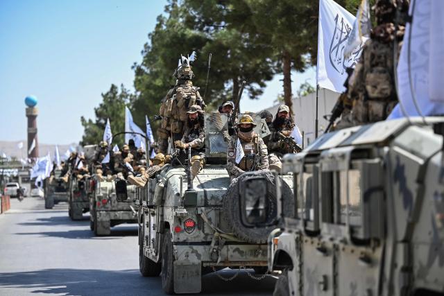 A convoy of Taliban security personnel take part in a parade in front of the former US Embassy building in Kabul on August 15, 2026 as they celebrate the fifth anniversary of the Taliban government's return to power. The Taliban government celebrates five years of ruling Afghanistan on August 15, with the authorities hailing their country's "freedom" and security, while critics decry tightening restrictions in all areas of daily life. (Photo by Wakil KOHSAR / AFP)