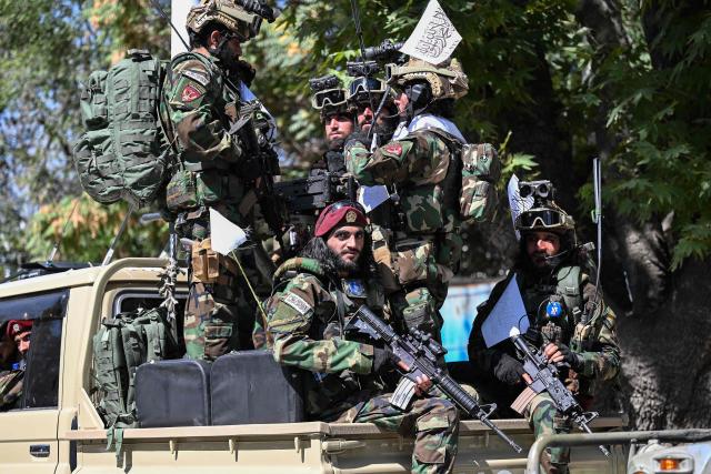 Taliban security personnel take part in a parade in front of the former US Embassy building in Kabul on August 15, 2026 as they celebrate the fifth anniversary of the Taliban government's return to power. The Taliban government celebrates five years of ruling Afghanistan on August 15, with the authorities hailing their country's "freedom" and security, while critics decry tightening restrictions in all areas of daily life. (Photo by Wakil Kohsar / AFP)