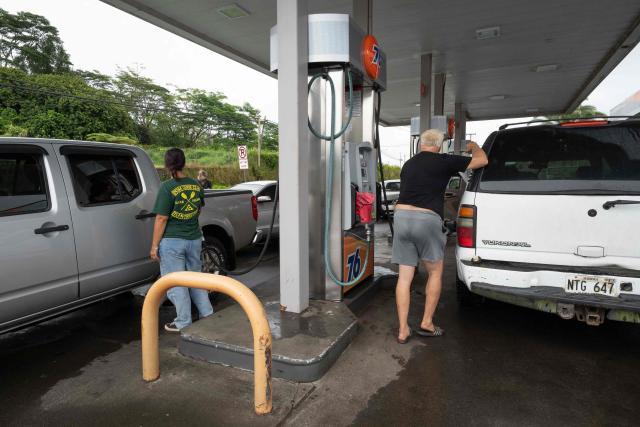 Residents fill their cars with gas in preparation for the arrival of Tropical Storm Lala to the big island of Hawaii on August 14, 2026. A strengthening tropical storm named Lala is set to hit Hawaii's Big Island with hurricane force on Saturday, bringing dangerous winds, rainfall and surf as the state's governor declared a state of emergency. (Photo by Jill K. Briggs / AFP)