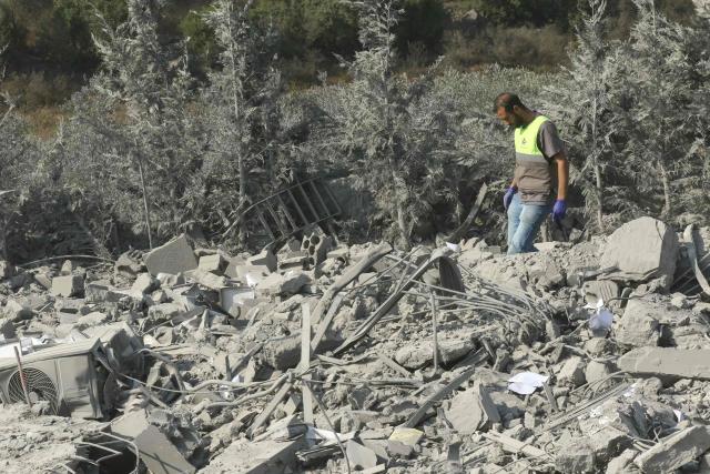 First responders searches for survivors amidst the rubble on the aftermath of an Israeli airstrike that targeted a house in the southern Lebanese village of Ansar on August 15, 2026. Lebanese state media said an Israeli strike in the country's south on August 15, killed seven people and wounded three others, the worst toll since deals in June saw a lull in hostilities between Israel and Hezbollah. Hezbollah drew Lebanon into the Middle East war in March with rocket fire at Israel in support of its backer Iran. Israel responded with heavy airstrikes and a ground invasion that Lebanese authorities say have killed more than 4,300 people. (Photo by Mahmoud ZAYYAT / AFP)
