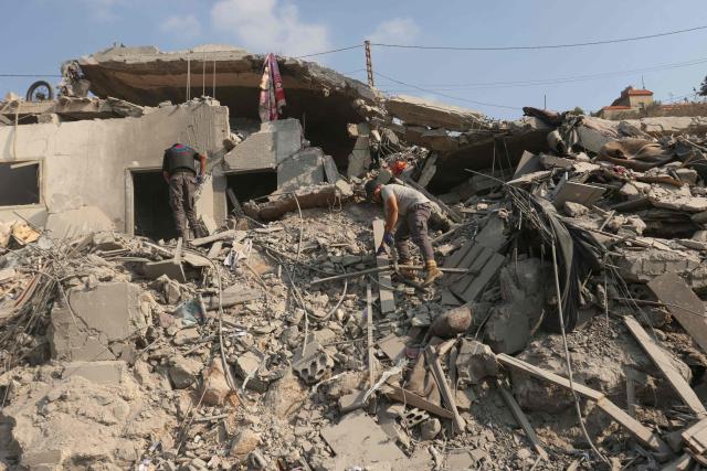 First responders searches for survivors amidst the rubble on the aftermath of an Israeli airstrike that targeted a house in the southern Lebanese village of Ansar on August 15, 2026. Lebanese state media said an Israeli strike in the country's south on August 15, killed seven people and wounded three others, the worst toll since deals in June saw a lull in hostilities between Israel and Hezbollah. Hezbollah drew Lebanon into the Middle East war in March with rocket fire at Israel in support of its backer Iran. Israel responded with heavy airstrikes and a ground invasion that Lebanese authorities say have killed more than 4,300 people. (Photo by MAHMOUD ZAYYAT / AFP)