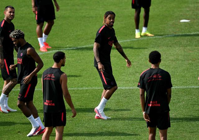 PSG's French forward #29 Bradley Barcola (C) looks on during a training session at the Paris Saint-Germain's campus in Poissy, west of Paris on August 15, 2026, on the eve of their French Super Cup (Trophee des Champions) football match against RC Lens. (Photo by LOU BENOIST / AFP)