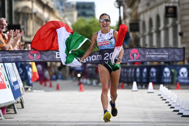 Italy's Sofia Fiorini celebrates as she crosses the finish line to win the women's marathon race walk and breaks the world record during the European Athletics Championships in Birmingham on August 15, 2026. (Photo by Paul ELLIS / AFP)