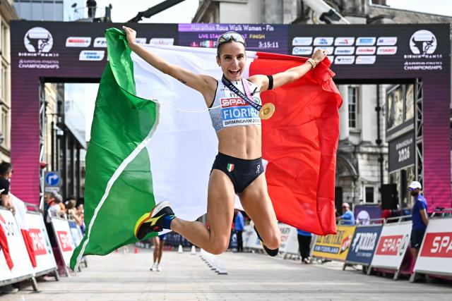 Gold medallist Italy's Sofia Fiorini celebrates winning the women's marathon race walk and breaking the world record during the European Athletics Championships in Birmingham on August 15, 2026. (Photo by Paul ELLIS / AFP)