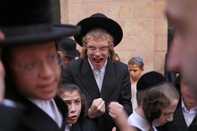 Ultra-Orthodox protesters demonstrate against Cafe Basimta operating on Shabbat, the weekly Jewish day of rest, as secular activists stage a counter-protest in support of the cafe, in central Jerusalem, on August 15, 2026. (Photo by AHMAD GHARABLI / AFP)