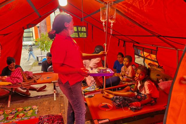 Patients are treated in a temporary medical tent due to fears of aftershocks in Maumere on Flores Island on August 15, 2026, following a 7.7-magnitude earthquake. Rescuers combed through debris for survivors after a powerful earthquake struck off Indonesia's Flores Island on August 15, killing at least 38 people, according to a disaster official. (Photo by ARNOLD WELIANTO / AFP)