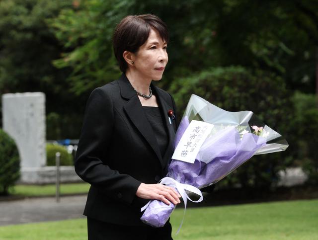Japan's Prime Minister Sanae Takaichi offers flowers at the Chidorigafuchi National Cemetery in Tokyo on August 15, 2026, on the 81st anniversary of Japan's surrender in World War II. (Photo by JIJI Press / AFP) / Japan OUT