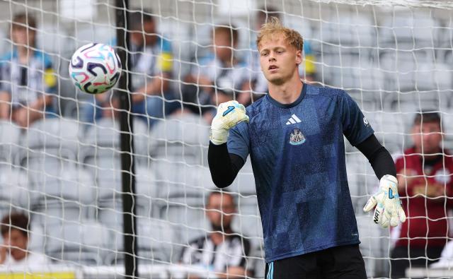 Newcastle United's Czech goalkeeper #21 Lukaas Hornicek warms up ahead of the pre-season friendly football match between Newcastle United and Bayer 04 Leverkusen at St James' Park in Newcastle-upon-Tyne, north east England on August 15, 2026. (Photo by SCOTT HEPPELL / AFP)
