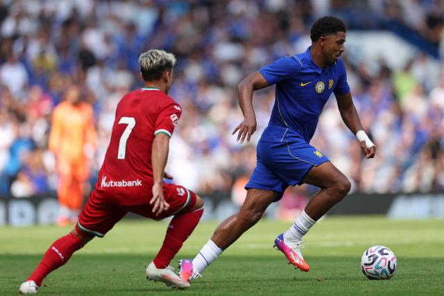 Chelsea's French defender #03 Wesley Fofana runs away from Real Sociedad's Spanish striker #07 Ander Barrenetxea during the pre-season friendly football match between Chelsea and Real Sociedad at Stamford Bridge in London on August 15, 2026. (Photo by Adrian Dennis / AFP)