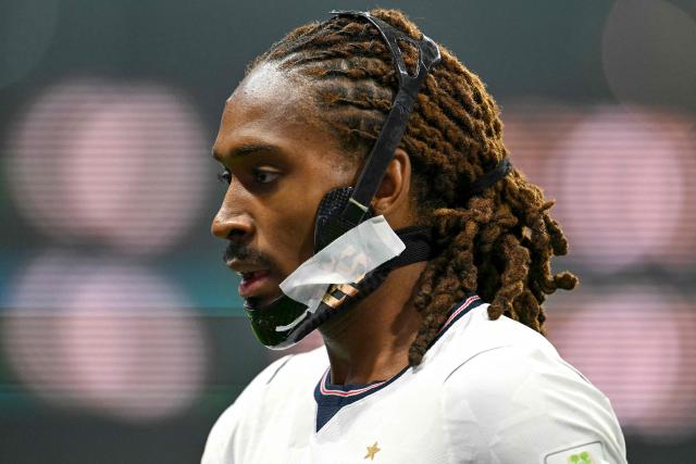 (FILES) England's defender #25 Djed Spence looks on during the 2026 World Cup round of 16 football match between Mexico and England at the Mexico City Stadium in Mexico City on July 5, 2026. English defender Djed Spence has signed with Inter Milan until 2031, the reigning Italian champions announced on August 15, 2026. "The English full-back, born in 2000, joins the *Nerazzurri* from Tottenham on a permanent transfer. Spence has signed a contract with the club running until June 30, 2031," Inter stated in their announcement. According to the specialist website Transfermarkt, Inter paid 30 million for the 26-year-old right-back. (Photo by Yuri CORTEZ / AFP)
