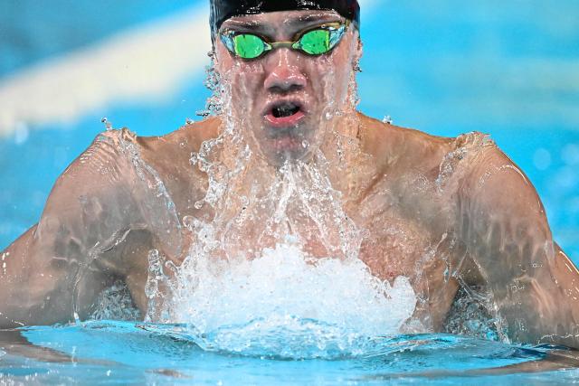 Neutral Athlete B's Mikhail Shcherbakov  competes in  a semi-final of the men's 200m individual medley swimming event during the LEN European Aquatics Championships at the Olympic Aquatic Centre in Saint-Denis, northern suburbs of Paris, on August 15, 2026. (Photo by JULIEN DE ROSA / AFP)