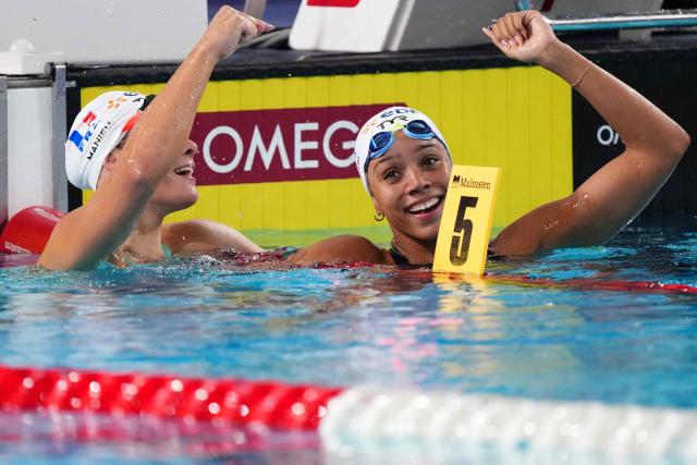 France's Mary-Ambre Moluh (R) celebrates her victory next to France's Pauline Mahieu (runner-up) at the end of the final of the women's 100m backstroke swimming event during the LEN European Aquatics Championships at the Olympic Aquatic Centre in Saint-Denis, northern suburbs of Paris, on August 15, 2026. (Photo by Dimitar DILKOFF / AFP)