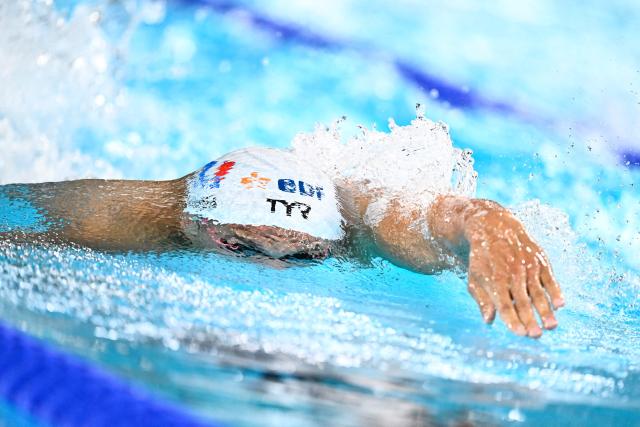 France's Roman Fuchs competes in  the final of the mixed 4x200m freestyle relay swimming event during the LEN European Aquatics Championships at the Olympic Aquatic Centre in Saint-Denis, northern suburbs of Paris, on August 15, 2026. (Photo by JULIEN DE ROSA / AFP)