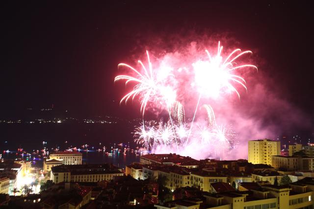 This photograph shows the firework during celebrations for the Assumption Day over the city of Ajaccio on the French Mediterranean island of Corsica on August 15, 2026. (Photo by Pascal POCHARD-CASABIANCA / AFP)